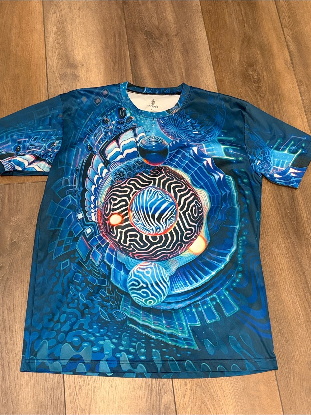 Blue Psychedelic Orb Graphic Tee by threyda